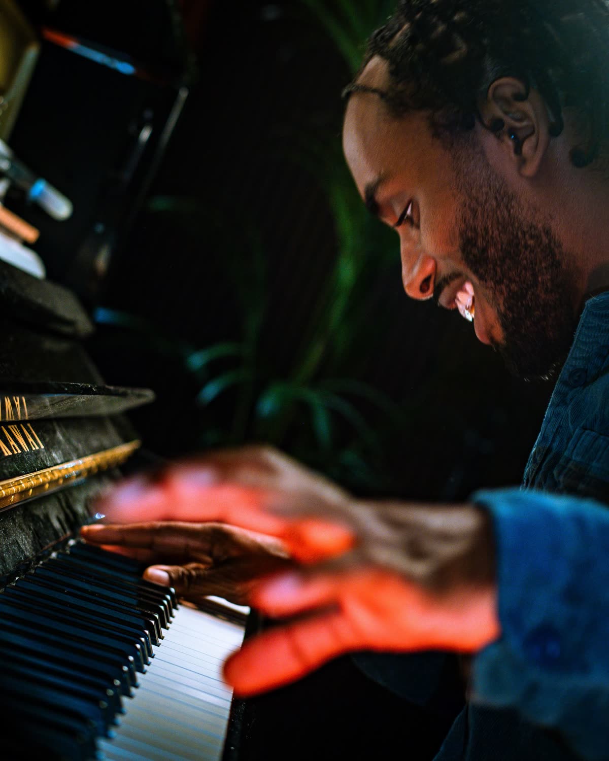 Judah's hands on the keys, smiling, close up